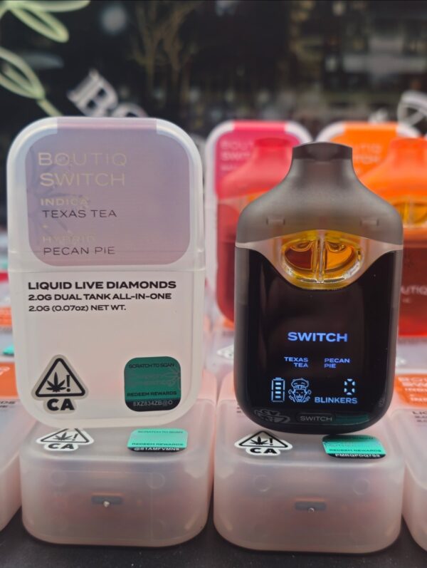 Sleek Boutiq Switch V4 disposable vape with dual-strain Boutiq V4 cart in black and gold, on a white background with subtle cannabis leaf accent.